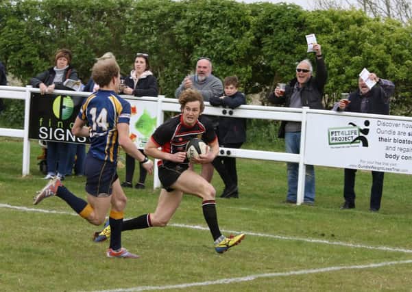 Callum Gardner scores the first Oundle try. Picture: Mick Sutterby