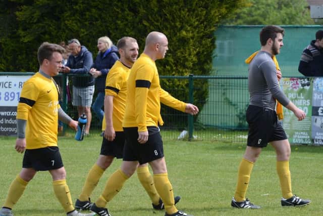 West Town players troop off after defeat in the McCain Cup Final. Photo: David Lowndes.