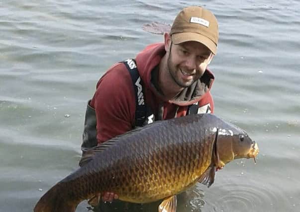 James Salmons with one of  the 30lb carp he caught at Northey Park.