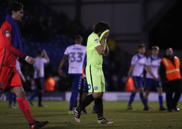Posh defender Michael Bostwick can't believe what's happened.