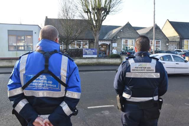 Parking problems outside Queens Drive primary school. Enforcement officers called in to help. EMN-170215-105245009