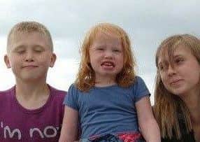 Callum, left, with sisters Lili-Maye (middle) and sister Kia