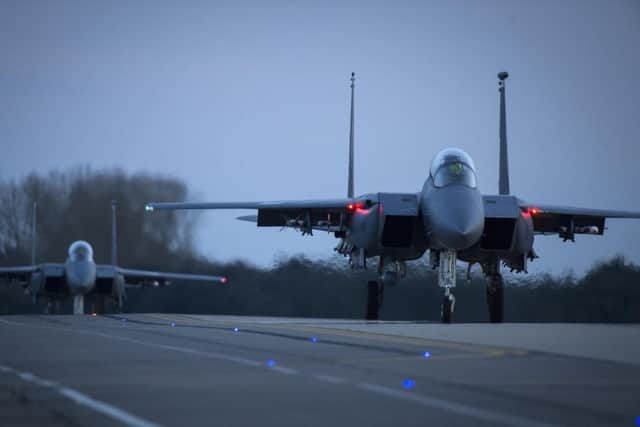 Two F-15E Strike Eagles taxi for take-off for a training sortie at Royal Air Force Lakenheath. (U.S. Air Force photo/Staff Sgt. Emerson NuÃ±ez)