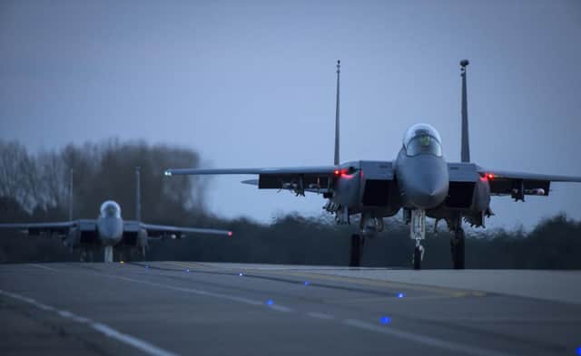 Two F-15E Strike Eagles taxi for take-off for a training sortie at Royal Air Force Lakenheath. (U.S. Air Force photo/Staff Sgt. Emerson NuÃ±ez)