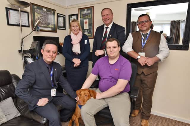 Former soldier  Daniel Johnson-Morris with his service dog Bart and Christopher Moon, Kristina Carrington, Brigadier Tim Seal and Andrew McGurk at Daniel's home at Gunthorpe. EMN-170331-183810009