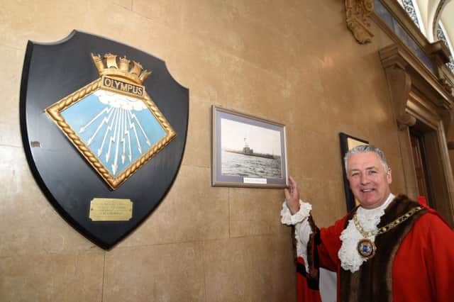 Mayor, David Sanders with the HMS/M Olympus plaque and picture hanging in the Town Hall EMN-170905-233720009