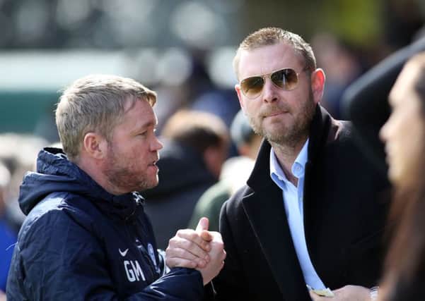 Posh chairman Darragh MacAnthony with manager Grant McCann.