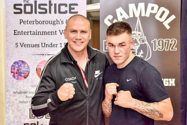 Peterborough Police Boxing Club coach Chris Baker with star fighter Kieran Cocker (right).