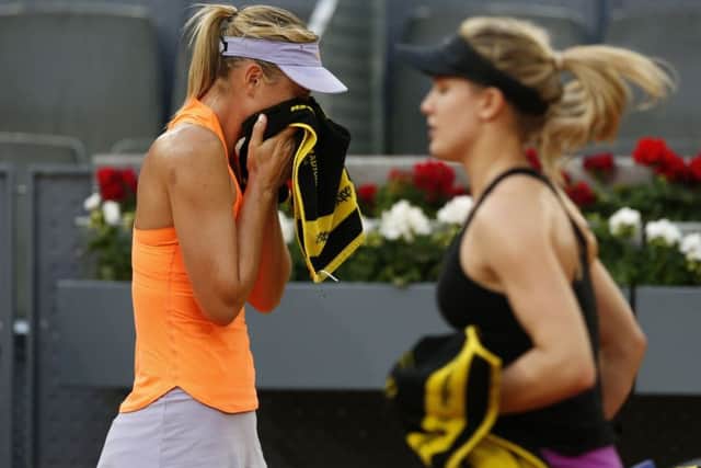 Eugenie Bouchard (right) and Maria Sharapova.