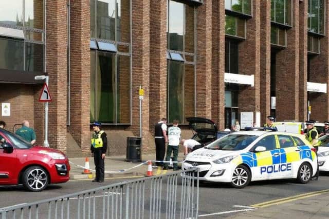 The scene outside the passport office in Peterborough following the security alert. Photo: Ricke Williams