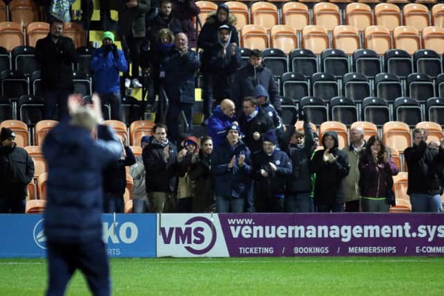 Posh manager Grant McCann applauds the 111 travelling fans who made it to Barnet in the Checkatrade Trophy.