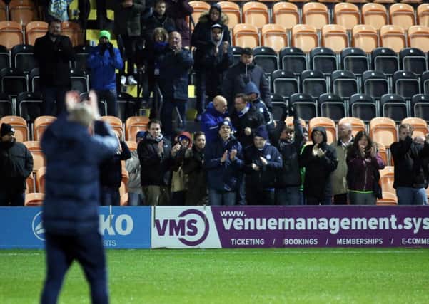 Posh manager Grant McCann applauds the 111 travelling fans who made it to Barnet in the Checkatrade Trophy.