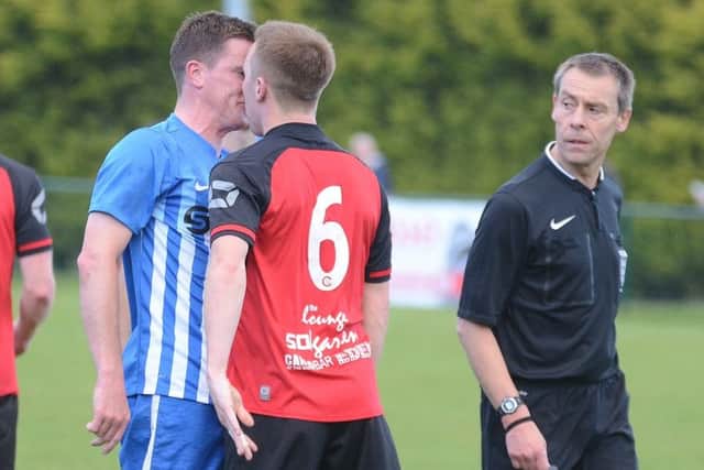Players go head to head in the President's Shield Final between Netherton (red) and Pinchbeck. Photo: David Lowndes.