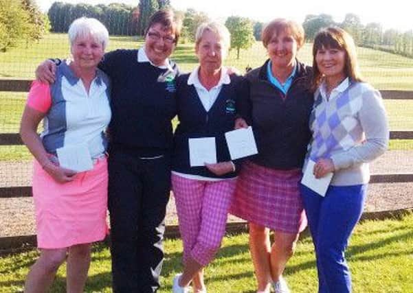 Nene Park lady captain Cath Hunt (second left) with the winning team at the am-am at Thorpe Wood.