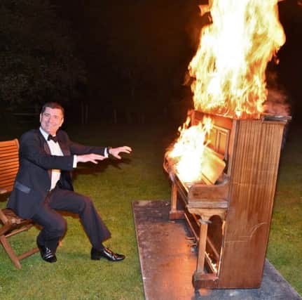 Mayor's Ball at Holiday Inn.  Terry Jones with the burning piano EMN-170514-085742009