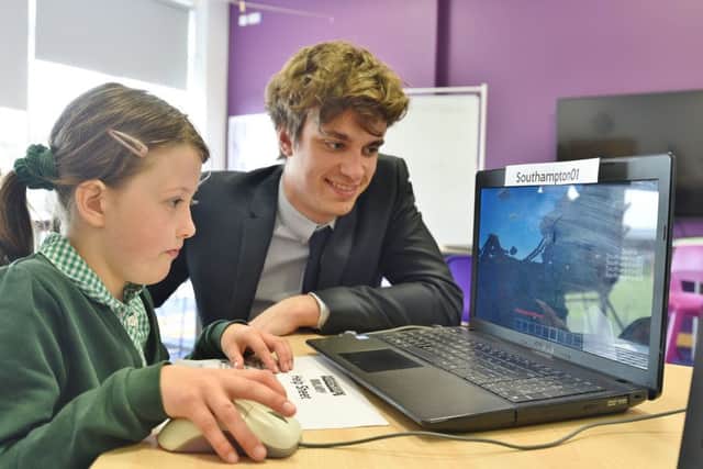 Pupils from Woodston Primary School taking part in a Minecraft IT session with Joe Roberts, an undergraduate student from Southampton University doing mechanical engineering EMN-170427-183841009
