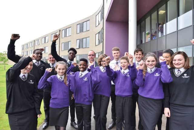 Stanground Academy principal James Scarrott with some of his students celebrating a Good OFSTED EMN-170516-134453009