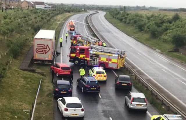The scene on the A605 where there has been a serious collision. Police, fire and air ambulance on the scene. Photo: Phil Palmer