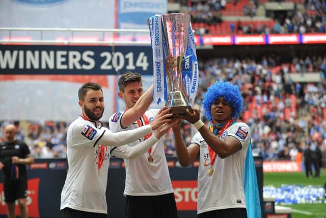 Posh players celebrate their Football League Trophy success.
