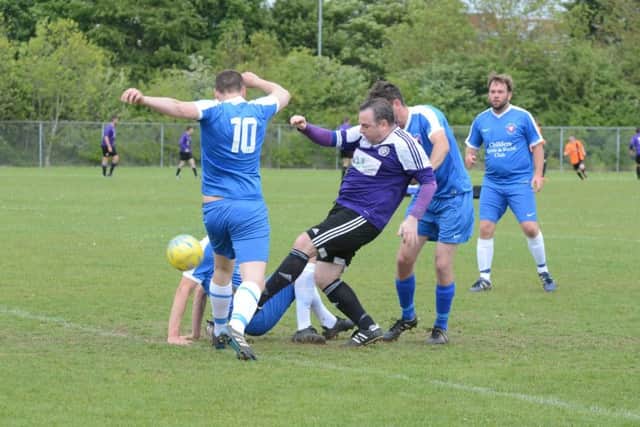 AFC Stanground Sports Reserves (purple) in action against Whittlesey Athletic A.