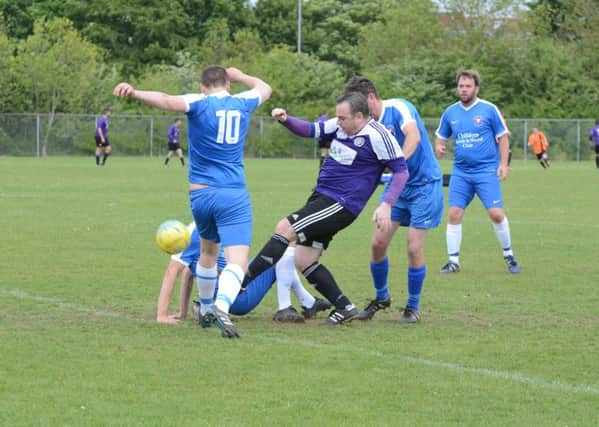 AFC Stanground Sports Reserves (purple) in action against Whittlesey Athletic A.