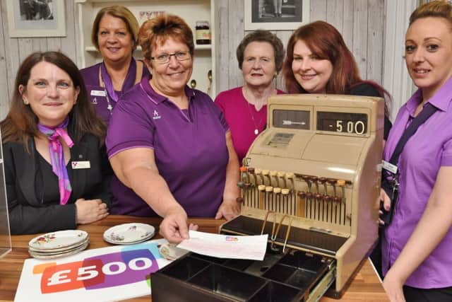Debbie Perkins and Zoe Dolby from Norwich and Peterborough Building Society present £500 cheque to Sheila Fielding, Chris Howchin and Gwen Sellars of Clayburn Care Home with Heather Nye (77) a resident, pictured in their new tea room. EMN-170516-181453009