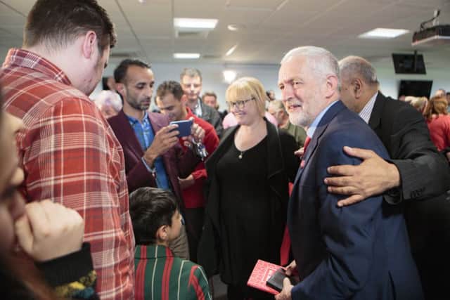 Jeremy Corbyn in Peterborough with Hasnain Nawaz aged 9. Picture by Terry Harris / Peterborough Telegraph. THA