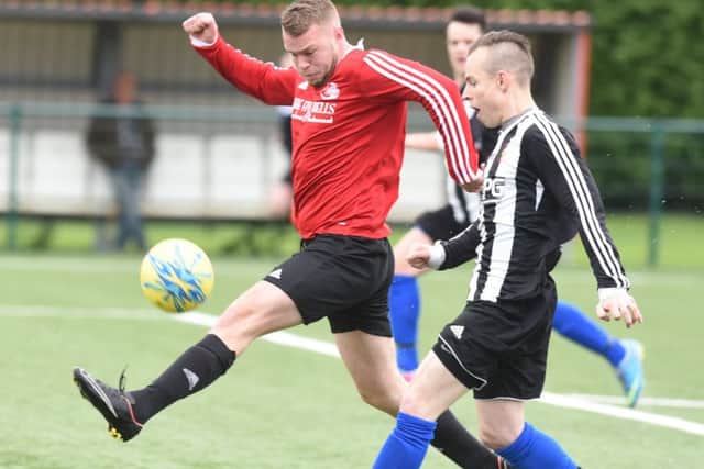 Action from the Peterborough League Division Two play-off final between Tydd St Mary and Langtoft United Reserves (black). Photo: David Lowndes.