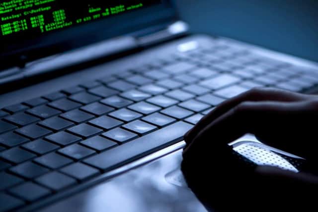 Hacker using laptop. Lots of digits on the computer screen. PPP-160119-104417001