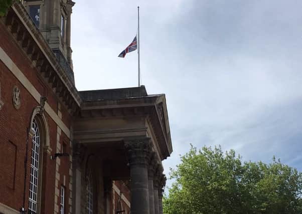The flag at half mast at the Town Hall
