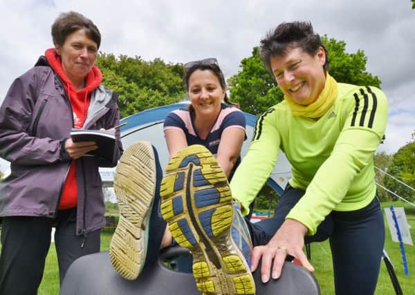 Discover Ferry Meadows weekend . Michael Brooker and his daughter Rosslyn Hamlyn from Running Breaks and Yvonne Goodsell from PT Eye with Angie Ware at the athletic coaching area. EMN-170520-194546009