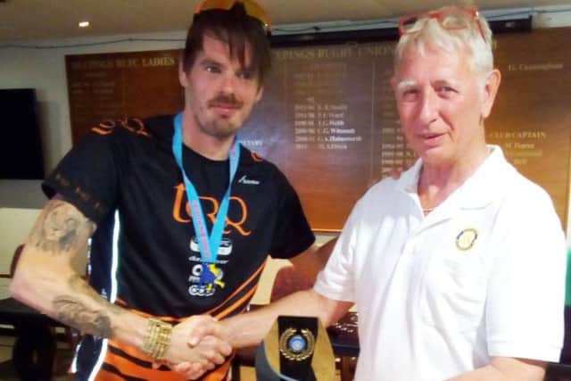 Phil Martin receives his prize from Deepings Rotary Club president Carl Midgley.
