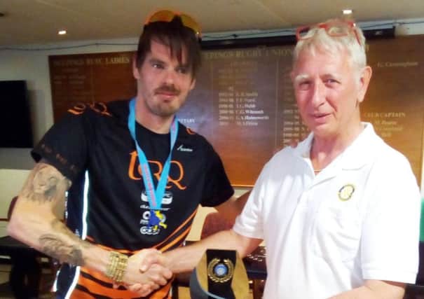 Phil Martin receives his prize from Deepings Rotary Club president Carl Midgley.