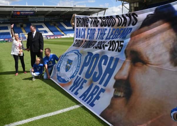A banner unveiled in honour of Chris Turner at his memorial match against Cambridge United in 2015. Watching are Lynne Turner and Bob Symns.