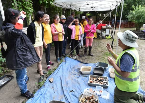 The Peterborough Cathedral Dig by University of Cambridge archaeologists and Peterborough volunteers in the grounds of the Deanery. Children from All Saints C of E primary school taking part EMN-160628-153734009