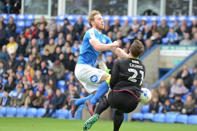 Craig Mackail-Smith in action for Posh last season.