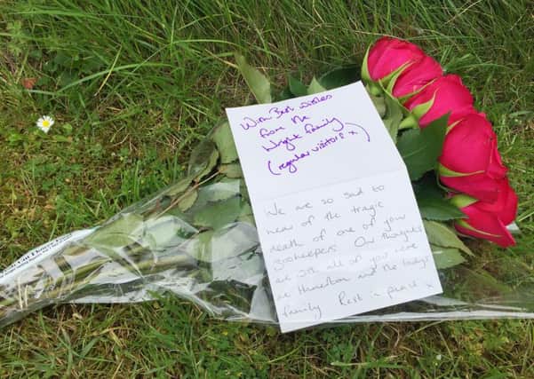 A floral tribute left at the entrance of Hamerton Zoo Park near Sawtry, Cambridgeshire, where a zookeeper was killed after a tiger entered the enclosure. Photo credit should read: Sam Russell/PA Wire POLICE_Zoo_123609.JPG