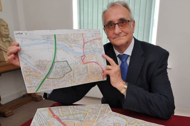 Peterborough City Council leader Cllr John Holdich with maps of proposed sites for a Peterborough University campus EMN-170530-145956009