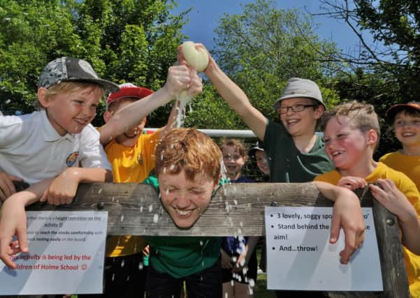 Holme Primary School reward day after a good Ofsted. Burt Papworth in the stocks EMN-170527-161856009