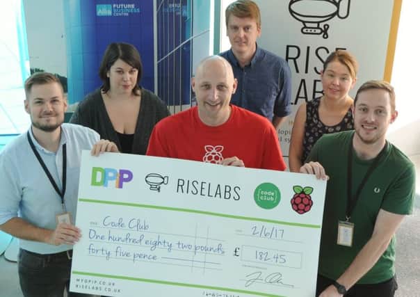 Left to right, Jack Howell (Riselabs), Liz Randall (DPiP), Marc Scott (Raspberry Pi Foundation), Andy Reedman (DPiP), Juliet Goldsmith (Future Business Centre) and Luke Tyler (Riselabs), at a cheque presentation to Code Club at the Allia Future Business Centre in Peterborough. Photo: David Lowndes EMN-170306-190214009
