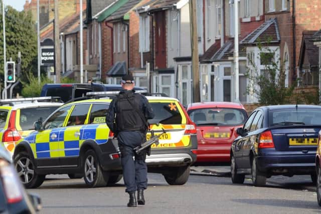 Armed Police during a previous operation in Padholme Road where there has been a firearms raid today