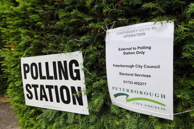 The polling station at The King's School showing a council CCTV warning