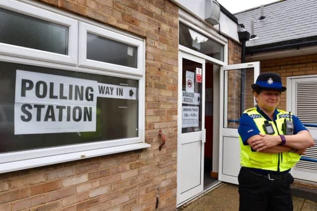 Police at the polling station at the Beeches School
