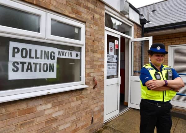 Police at the polling station at the Beeches School