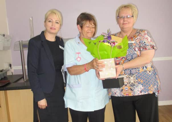 Care assistant Margaret Thompson was presented with her 20 years long service award at Werrington Lodge
