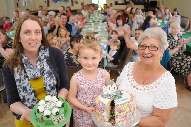 All Saints, Paston 800 years birthday party. Winners of the cake making competitionVictoria Bowywr and Jasmine Barnes with organiser Ivana Smith. EMN-170306-190125009