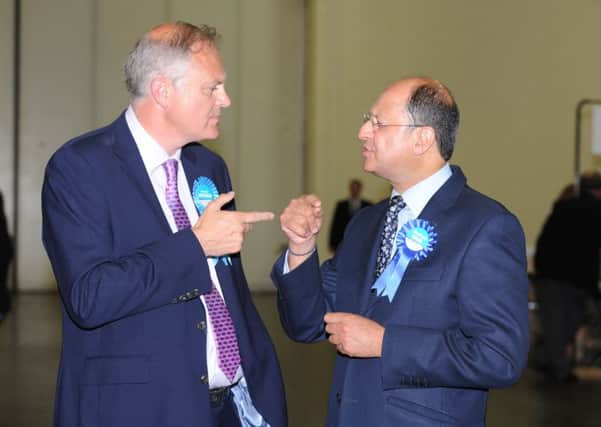 Stewart Jackson, left, discusses the vote with Shailesh Vara, right
