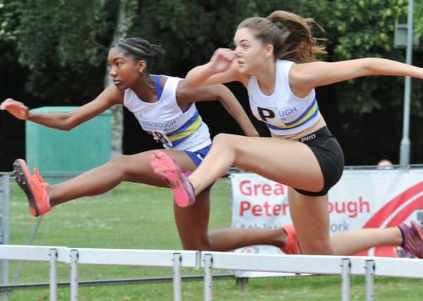 Jessica Dixon-Walker (left) and Ellie Forrest in hurdles action. Picture: David Lowndes