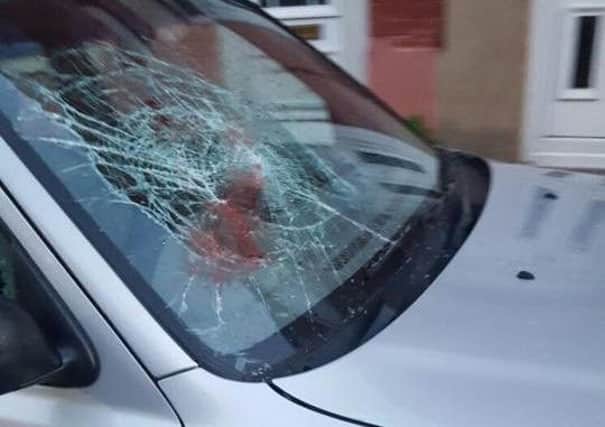 Some of the damage caused to cars in Russel Street on Thursday night. Photo: Mohammed Shahid O6hQJfprZ5JCTXZ_prDS