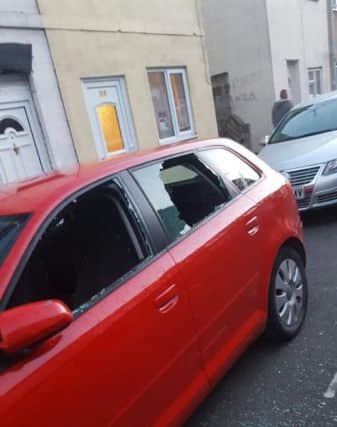 Some of the damage caused to cars in Russel Street on Thursday night. Photo: Mohammed Shahid DUVFMCB4gO1Cd9RPph2Y